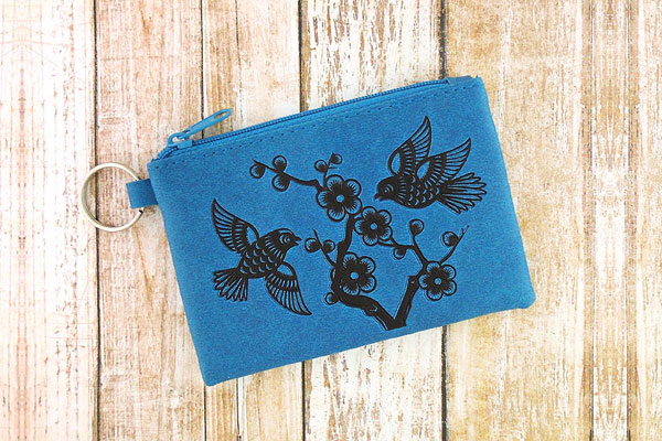 LAVISHY Akina collection wholesale fun vegan love birds & plum blossom flower embossed coin purses to gift shop, clothing & fashion accessories boutique, book store in Canada, USA & worldwide since 2001.