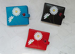 LAVISHY Akina collection wholesale fun vegan daisy flower & ladybug embossed medium wallets to gift shop, clothing & fashion accessories boutique, book store in Canada, USA & worldwide since 2001.