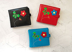 LAVISHY Akina collection wholesale fun vegan flower & butterfly embossed medium wallets to gift shop, clothing & fashion accessories boutique, book store in Canada, USA & worldwide since 2001.